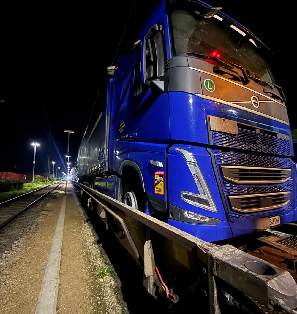 Delphic tractor unit loaded on an intermodal rail wagon in Europe