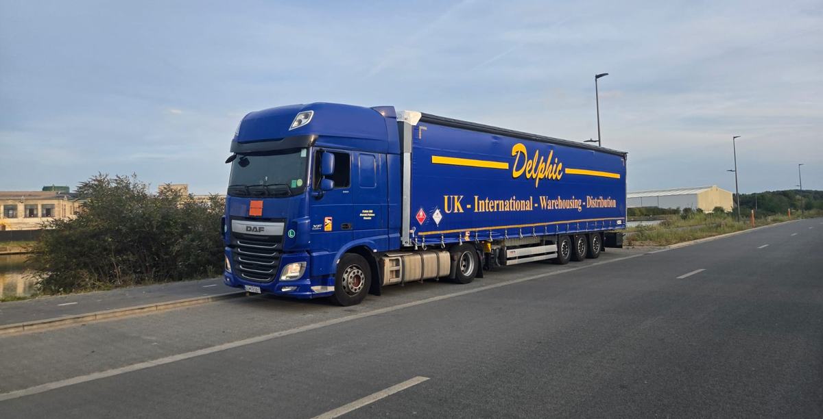 Delphic DAF and curtainsider on a main road on the continent